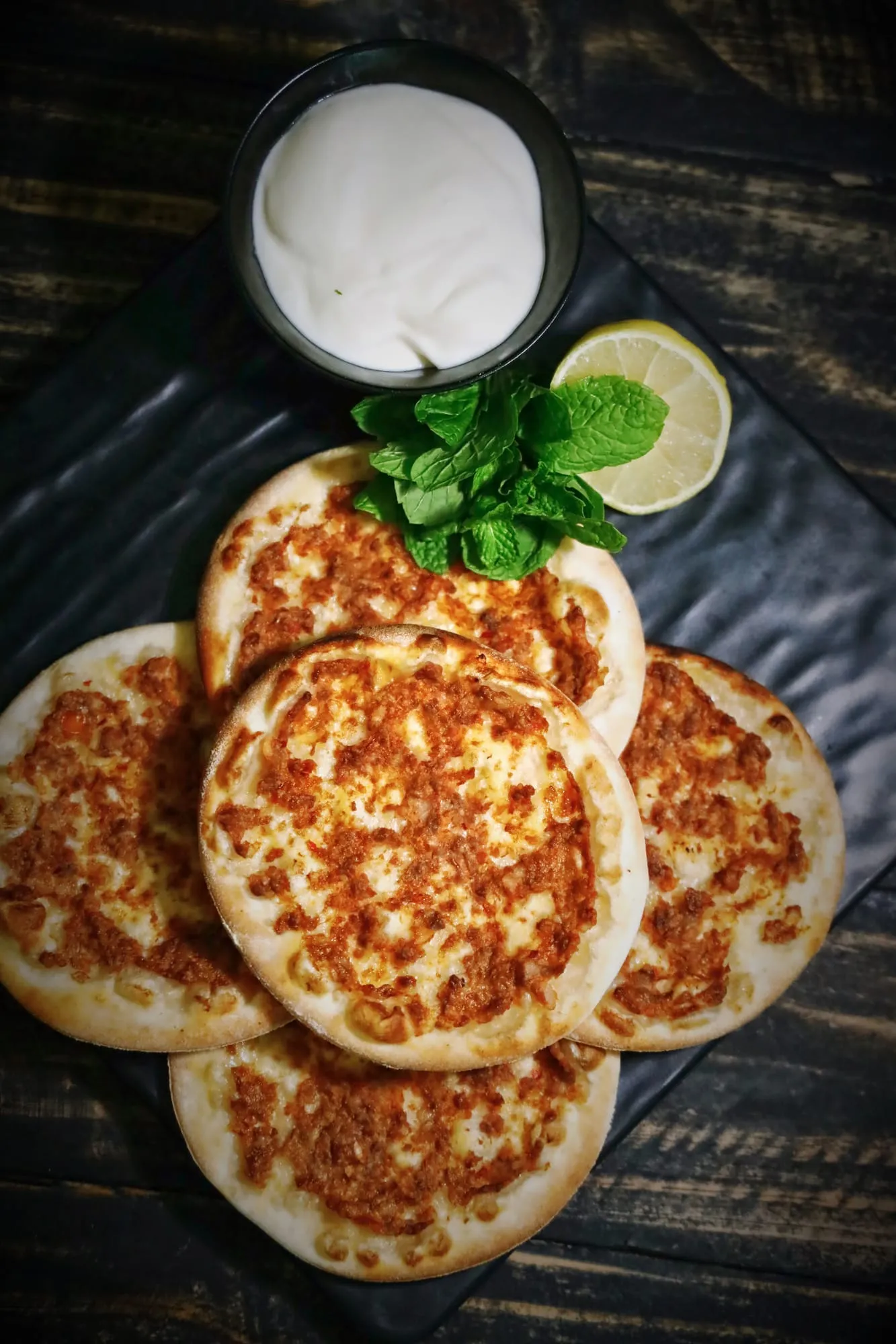 Flatbreads topped with spiced lamb and herbs