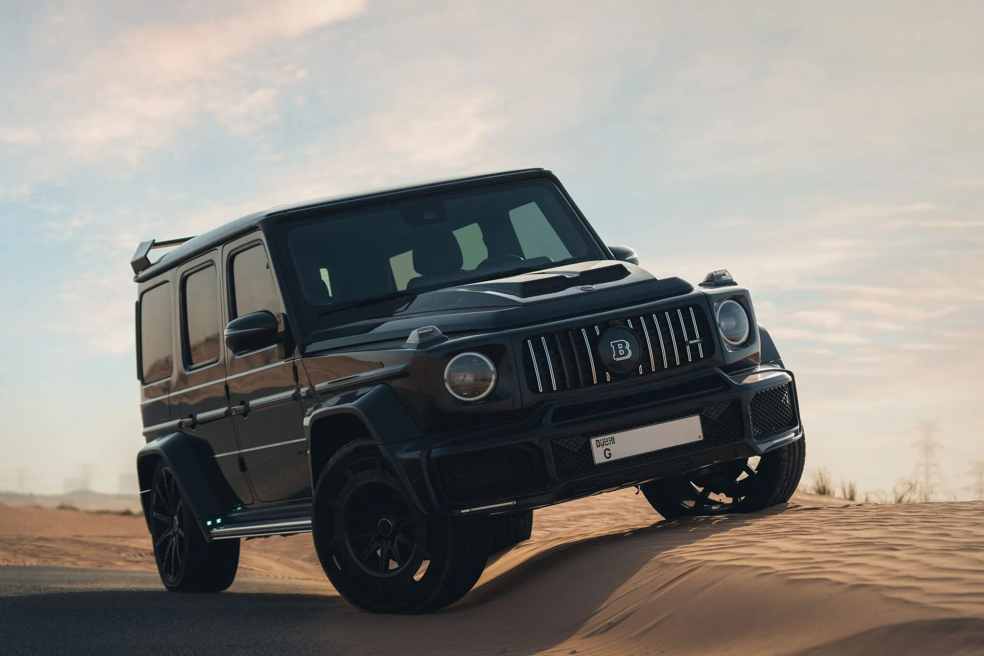 Black off-road SUV on a desert road