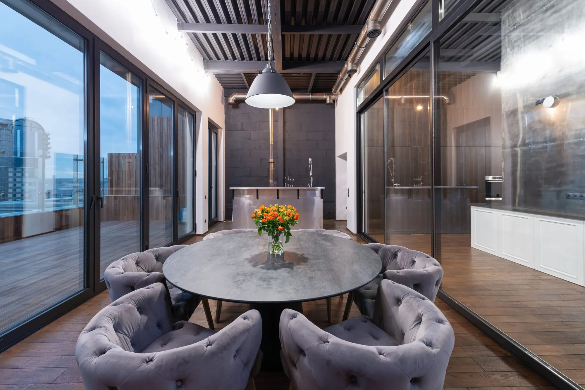 Penthouse dining room with floor-to-ceiling city views